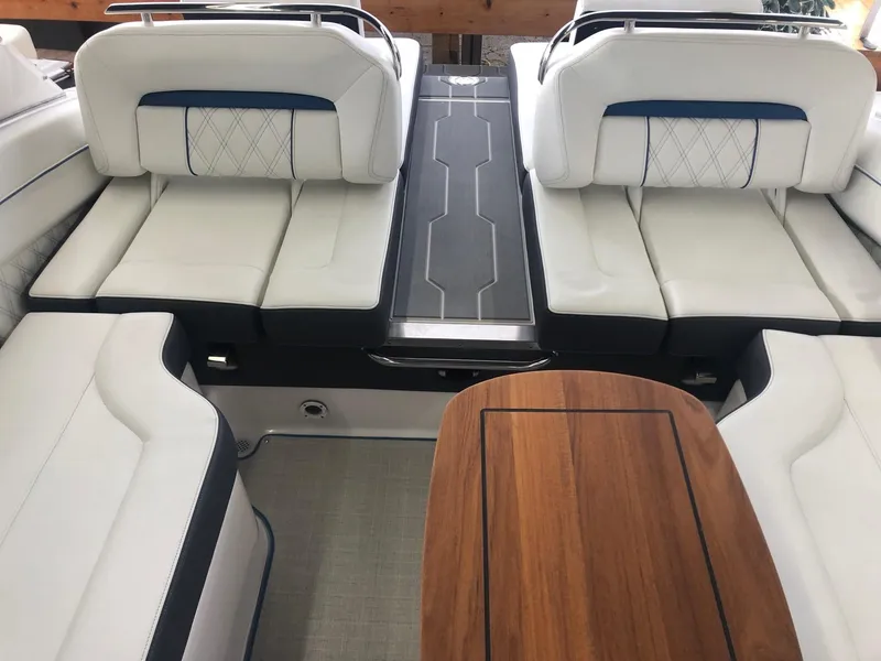 Slide: The Image of Interior of a 2020 Regal LS4 boat with luxurious white seating. - 28