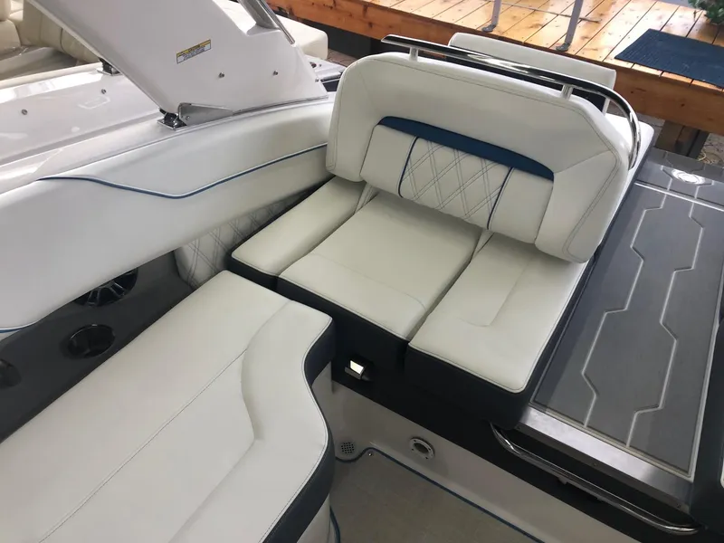 Slide: The Image of Interior of a 2020 Regal LS4 boat with luxurious white seating. - 29