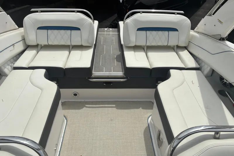 Slide: The Image of 2020 Regal LS4 boat interior with white cushioned seating and sleek design. - 3