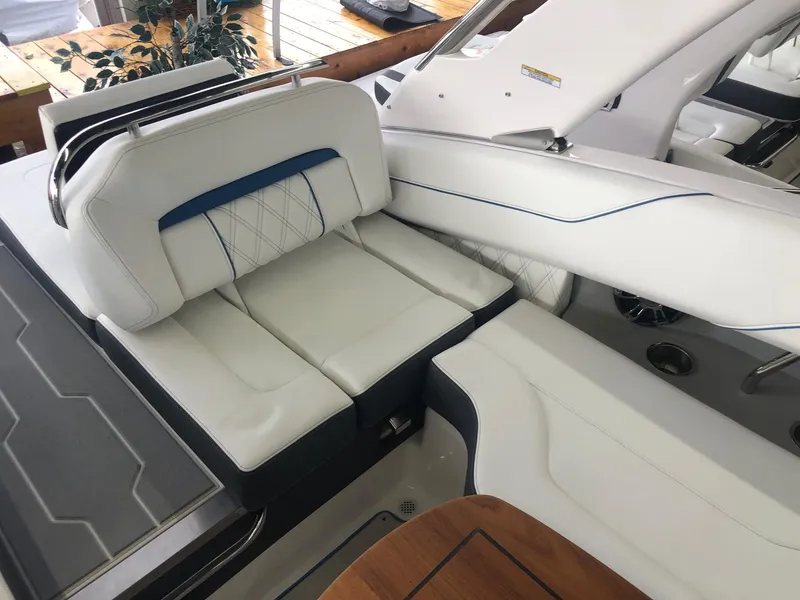 Slide: The Image of Interior of a 2020 Regal LS4 boat with luxurious white seating. - 30
