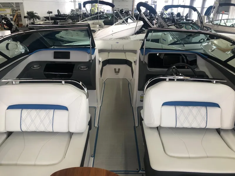 Slide: The Image of Interior of a 2020 Regal LS4 boat with luxurious white seating. - 33
