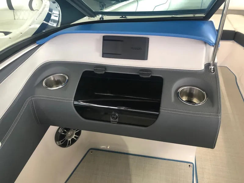 Slide: The Image of Interior of a 2020 Regal LS4 boat with cup holders. - 35