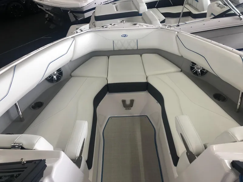 Slide: The Image of Interior view of a 2020 Regal LS4 boat with white upholstery. - 37