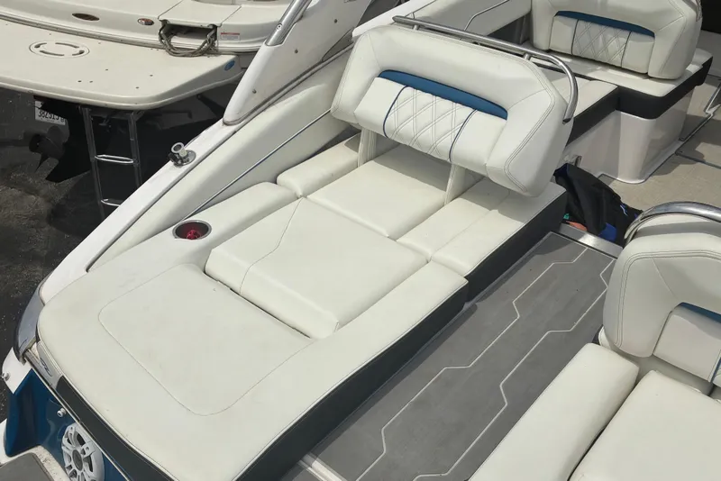 Slide: The Image of 2020 Regal LS4 boat interior with white and blue cushioned seating. - 4