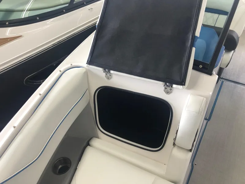 Slide: The Image of 2020 Regal LS4 boat with open storage compartment. - 41