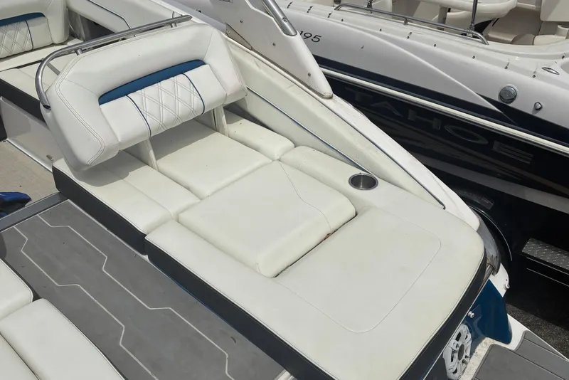 Slide: The Image of 2020 Regal LS4 boat with white cushioned seating and cup holder. - 5