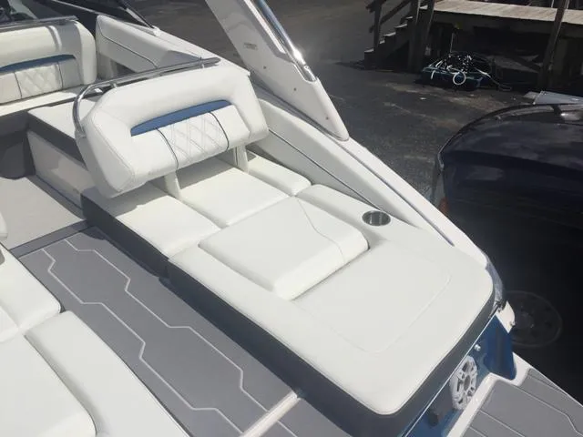 Slide: The Image of 2020 Regal LS4 boat featuring luxurious white seating. - 6