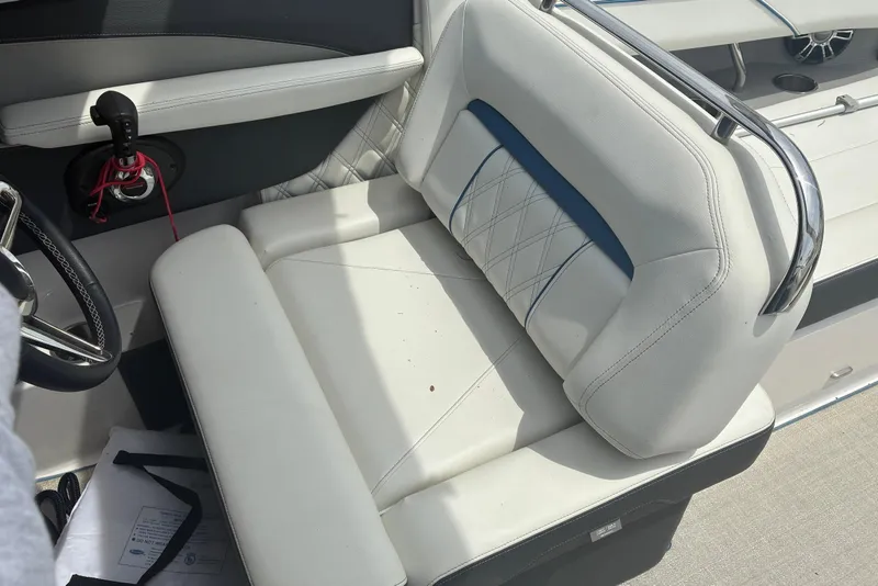 Slide: The Image of 2020 Regal LS4 boat interior with white leather seating and chrome accents. - 9