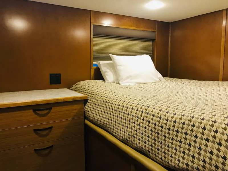 Slide: The Image of Cozy bedroom in 2014 Bravada Imagination Trip 11 houseboat with wooden interior. - 10