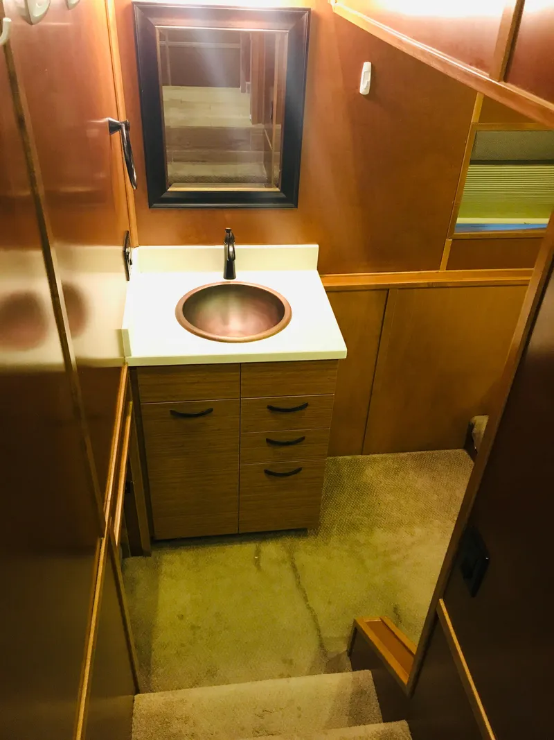 Slide: The Image of Compact bathroom in 2014 Bravada Imagination Trip 11, featuring modern sink and mirror. - 12