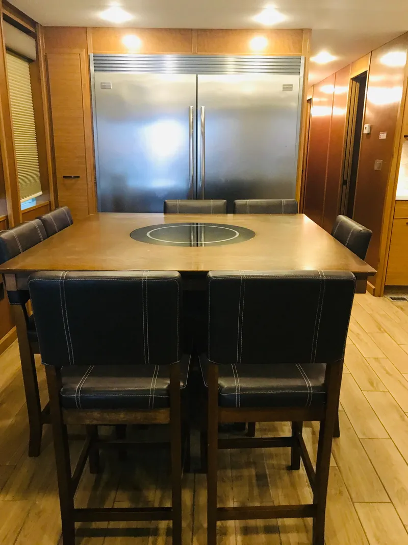 Slide: The Image of Luxurious dining area in 2014 Bravada Imagination Trip 11 houseboat. - 16