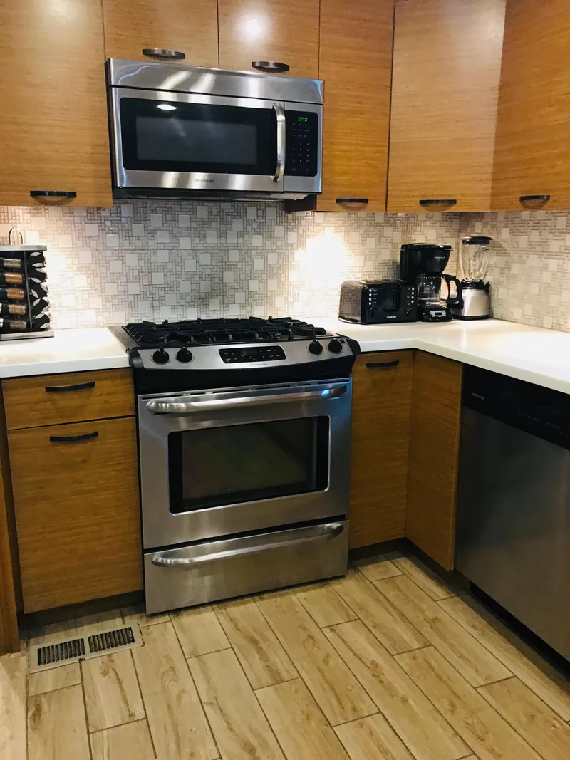 Slide: The Image of Modern kitchen with stainless steel appliances and wooden cabinets, 2014 Bravada Imagination Trip 11. - 18