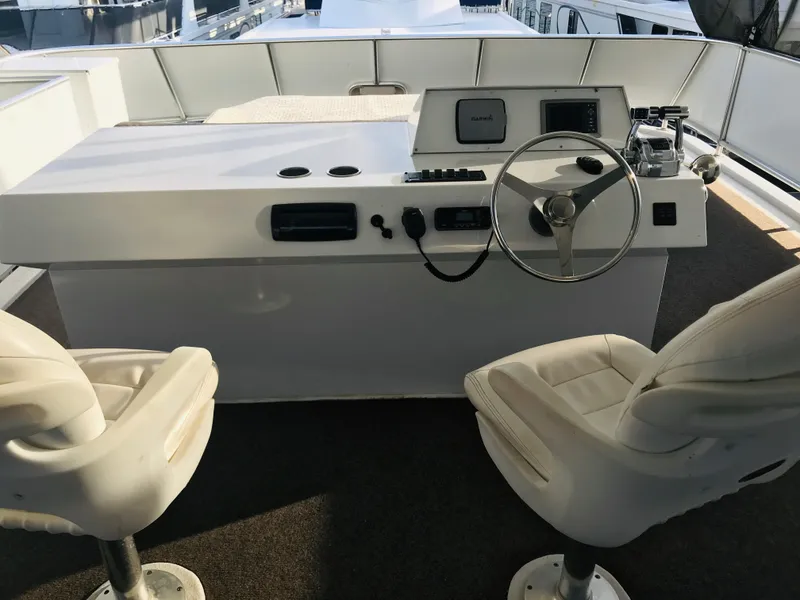 Slide: The Image of Helm of 2014 Bravada Imagination Trip 11 yacht with dual white captain chairs. - 28