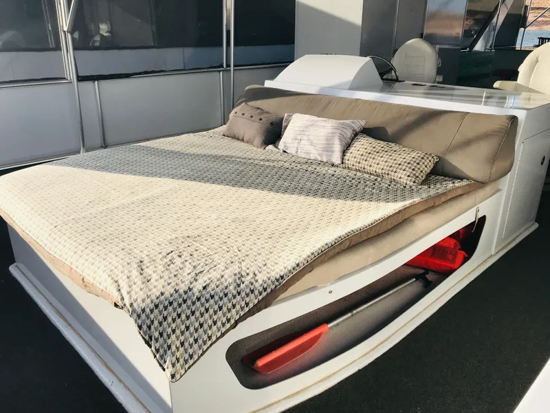 Slide: The Image of Luxurious bed on 2014 Bravada Imagination Trip 11 houseboat, featuring cozy pillows and modern design. - 30