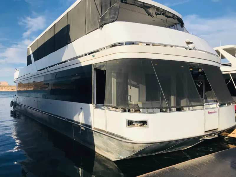 Slide: The Image of 2014 Bravada Imagination Trip 11 houseboat on water, featuring modern design and shared ownership. - 32