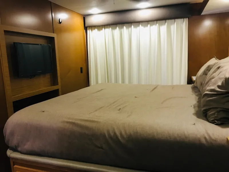 Slide: The Image of Cozy bedroom in 2014 Bravada Imagination Trip 11, featuring a TV and elegant curtains. - 5