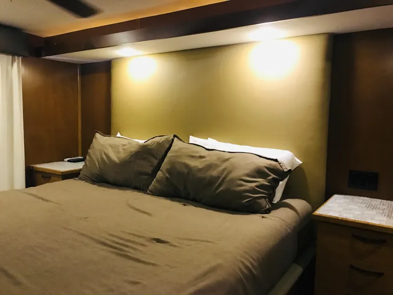 Slide: The Image of Cozy bedroom in 2014 Bravada Imagination Trip 11, featuring warm lighting and plush bedding. - 6