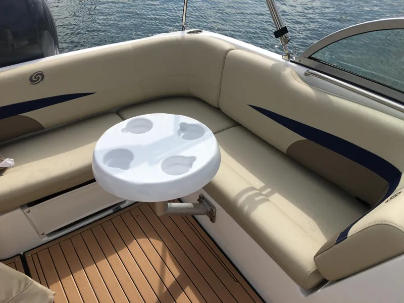 Slide: The Image of 2019 Hurricane SD 187 boat interior with cushioned seating and a round table. - 6
