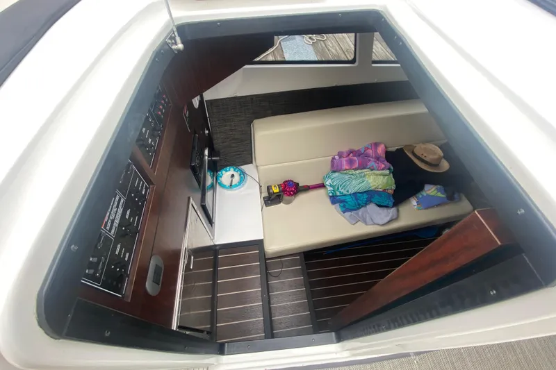 Slide: The Image of Interior of 2020 Monterey 385 Super Express boat with seating and control panels. - 19