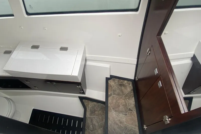 Slide: The Image of Interior of 2020 Monterey 385 Super Express boat with modern cabinetry and flooring. - 23