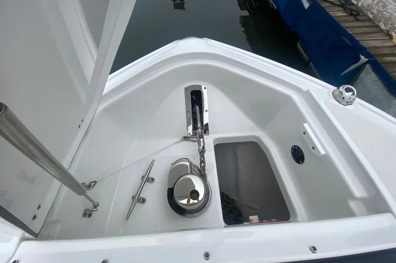 Slide: The Image of 2020 Monterey 385 Super Express boat anchor compartment with chain and cleat. - 27