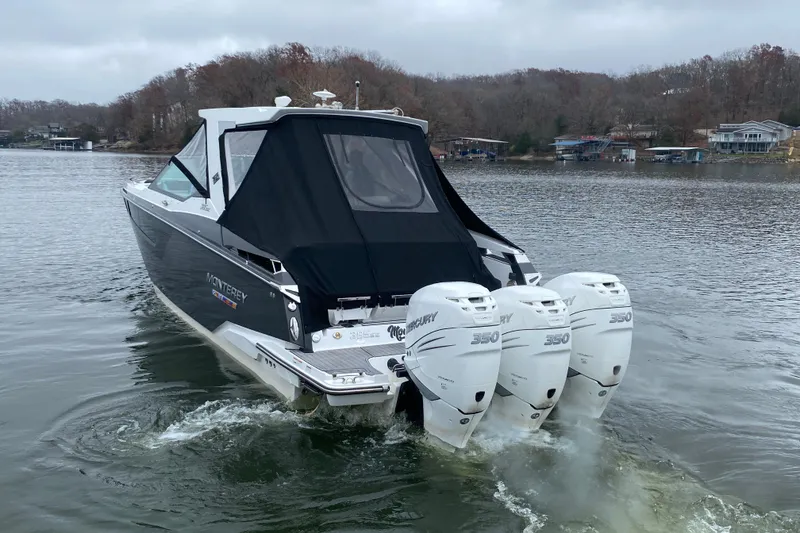 Slide: The Image of 2020 Monterey 385 Super Express boat with triple Mercury 350 engines on a lake. - 37