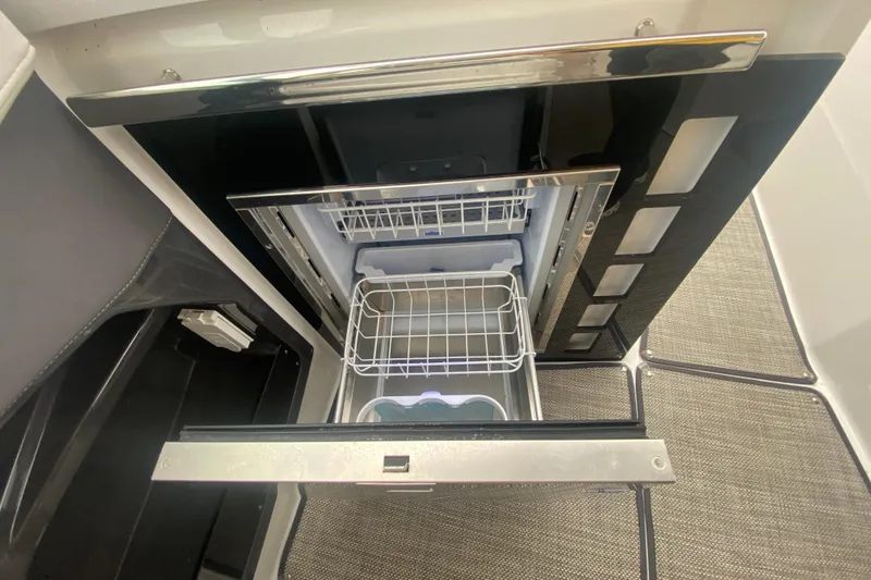Slide: The Image of Open drawer refrigerator in 2020 Monterey 385 Super Express boat interior. - 15