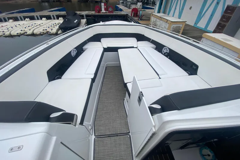 Slide: The Image of 2020 Monterey 385 Super Express boat interior with white seating and modern design. - 18