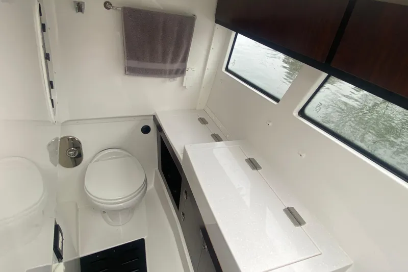 Slide: The Image of Interior of 2020 Monterey 385 Super Express boat bathroom with modern fixtures. - 24