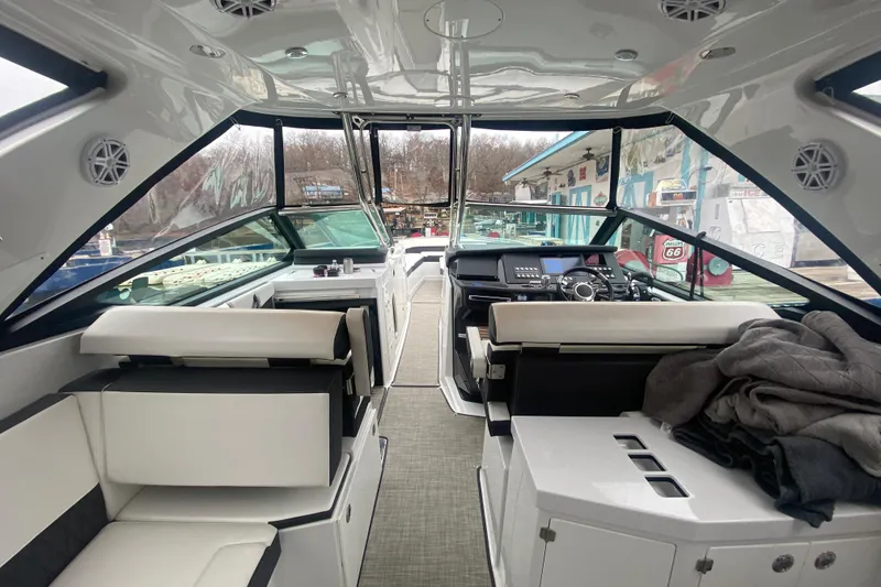 Slide: The Image of Interior of 2020 Monterey 385 Super Express yacht with modern seating and helm. - 33