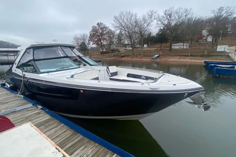 Slide: The Image of 2020 Monterey 385 Super Express boat docked on a calm lake with overcast skies. - 34