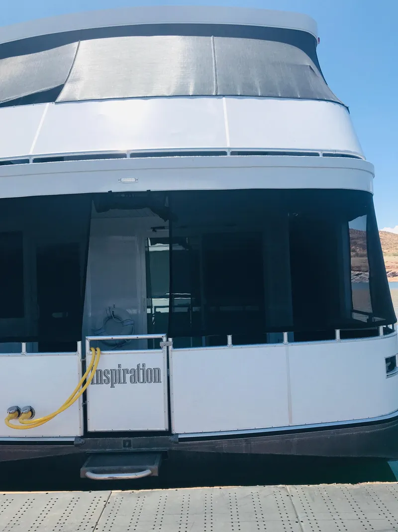 Slide: The Image of Luxury yacht "Inspiration Trip #9" by Adonia, 2019 model, docked under clear blue sky. - 2