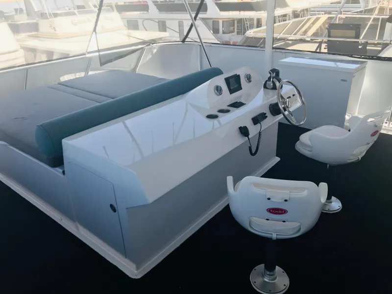 Slide: The Image of Control deck of 2019 Adonia Inspiration Trip #9 yacht with seating and navigation equipment. - 30