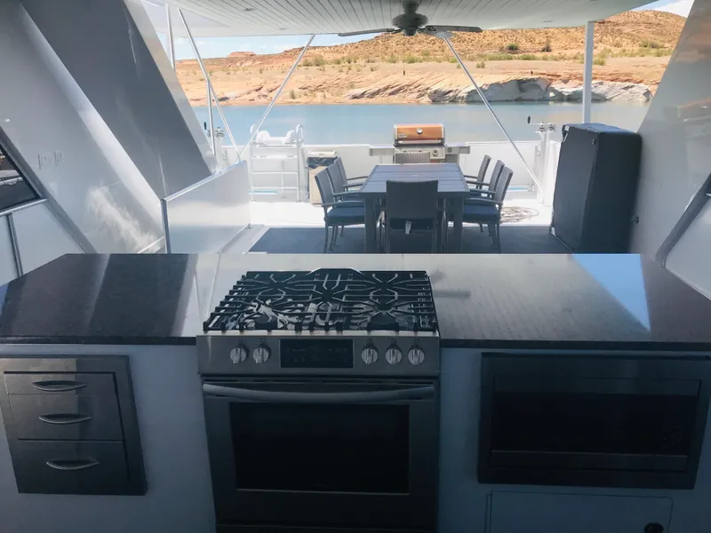 Slide: The Image of Luxurious houseboat kitchen and dining area on Adonia Inspiration Trip #9, 2019, with scenic lake view. - 35