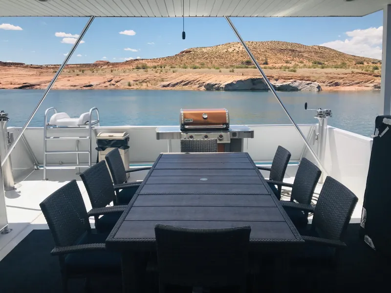Slide: The Image of Outdoor dining area on Adonia Inspiration Trip #9 houseboat, 2019, with scenic lake view. - 36