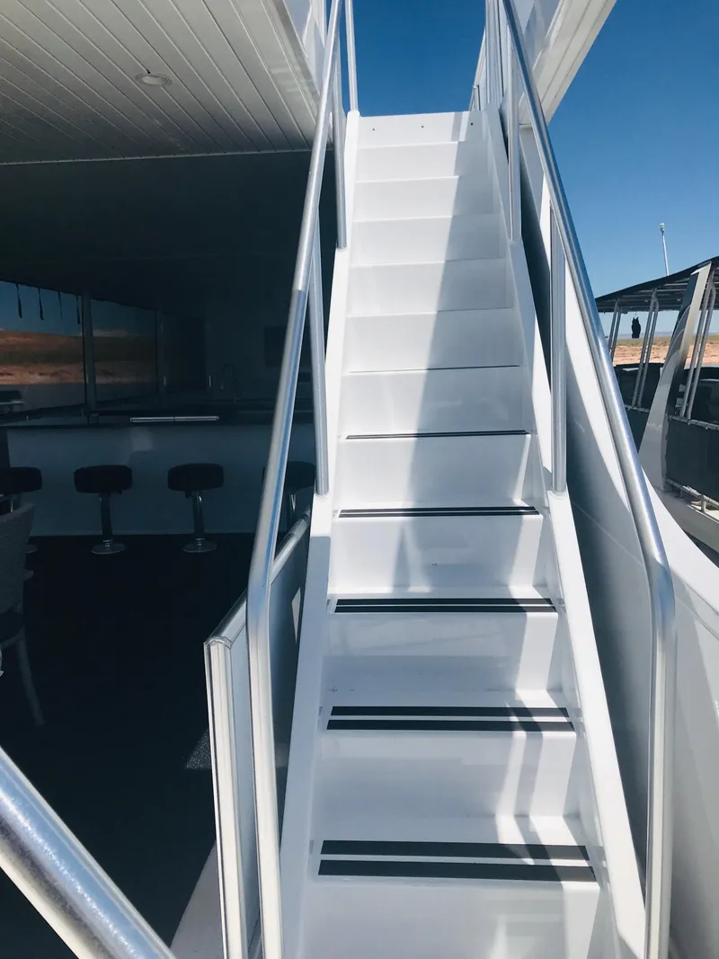 Slide: The Image of White staircase on Adonia Inspiration Trip #9 yacht, 2019 model, leading to upper deck. - 37