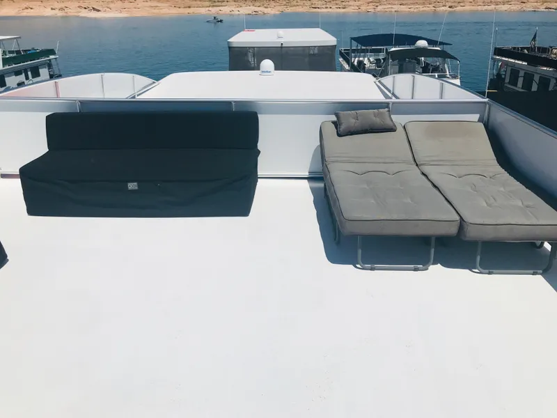 Slide: The Image of Rooftop deck of Adonia Inspiration Trip #9 houseboat, featuring lounge chairs, 2019 model. - 38