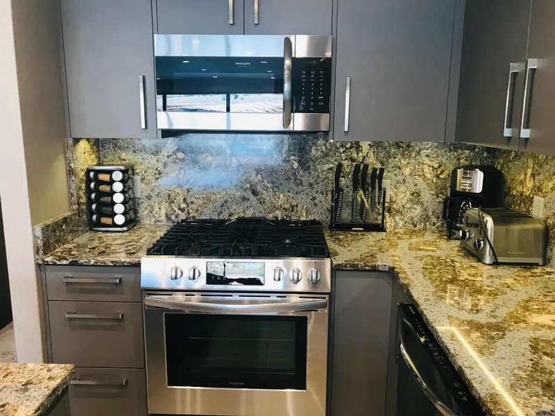 Slide: The Image of Modern kitchen with stainless steel appliances, granite countertops, and sleek cabinetry. Adonia Inspiration Trip #9, 2019. - 5