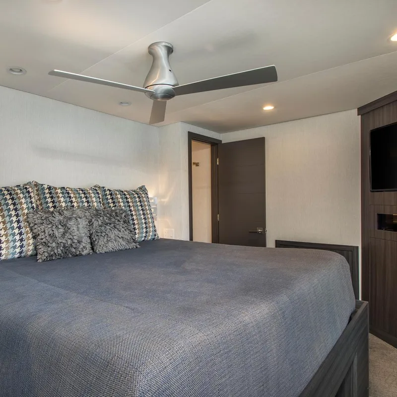 Slide: The Image of Modern bedroom with ceiling fan and stylish bed. - 5