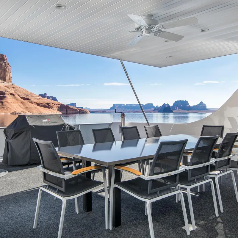 Slide: The Image of Houseboat deck with table, chairs, and lake view, Adonia Destiny Trip 2018. - 8