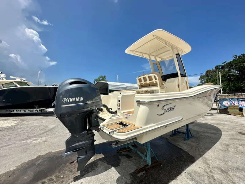 Slide: The Image of 2025 Scout 215 XSF boat with Yamaha outboard motor on display. - 10