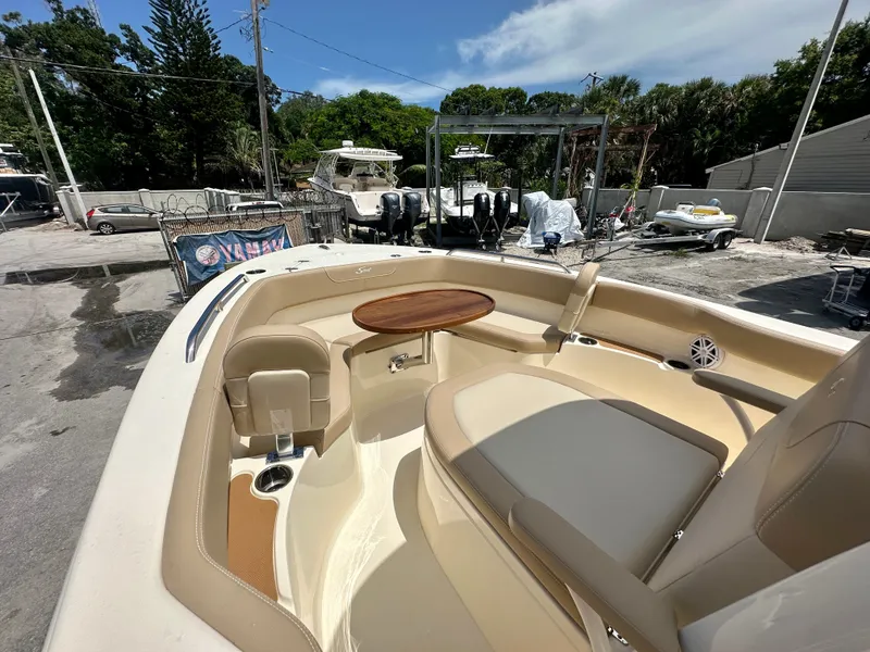 Slide: The Image of 2025 Scout 215 XSF boat interior with seating and table. - 4