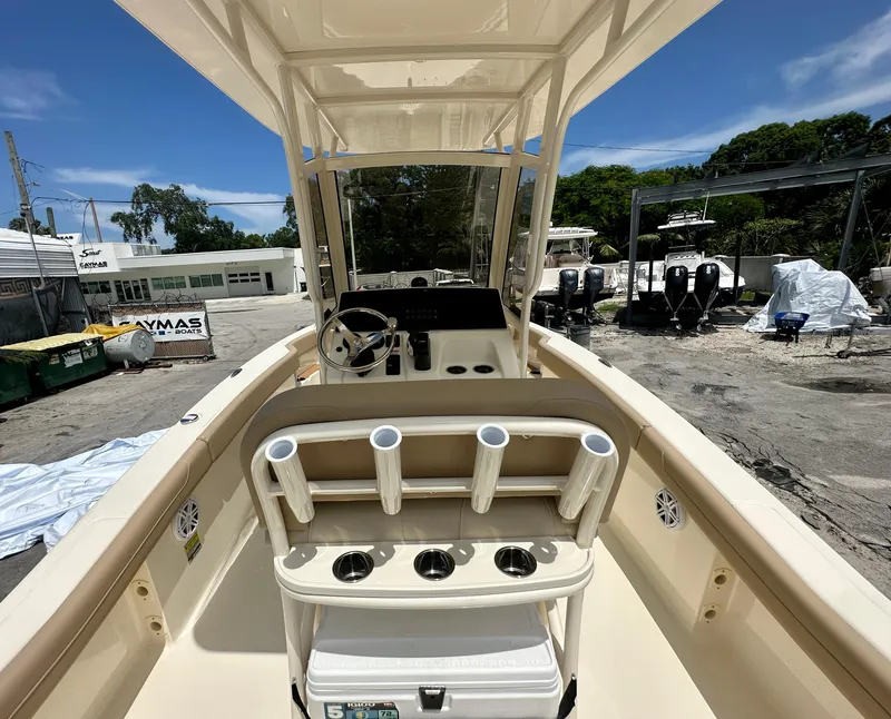 Slide: The Image of 2025 Scout 215 XSF boat interior with steering console and rod holders. - 8