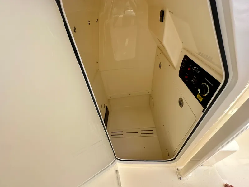 Slide: The Image of Interior cabin of 2025 Scout 215 XSF boat with control panel. - 9