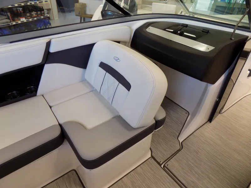 Slide: The Image of 2023 Regal 21 OBX boat interior with sleek seating and modern dashboard design. - 14