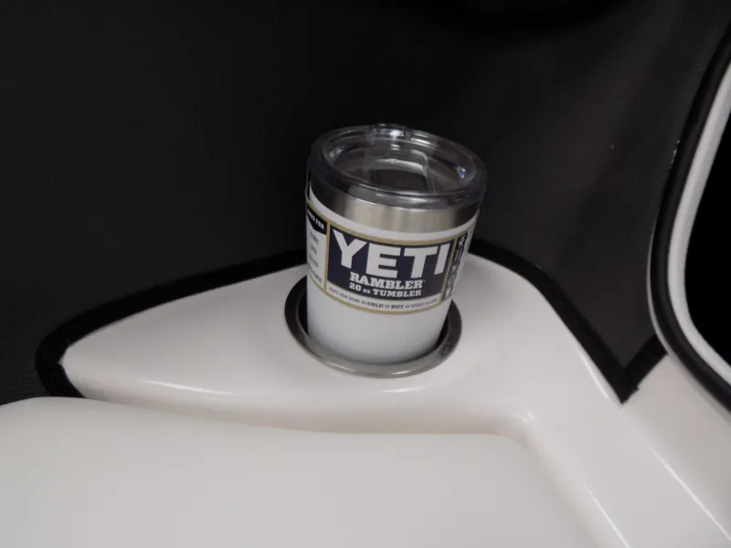 Slide: The Image of YETI tumbler in cup holder of 2023 Regal 21 OBX boat. - 19
