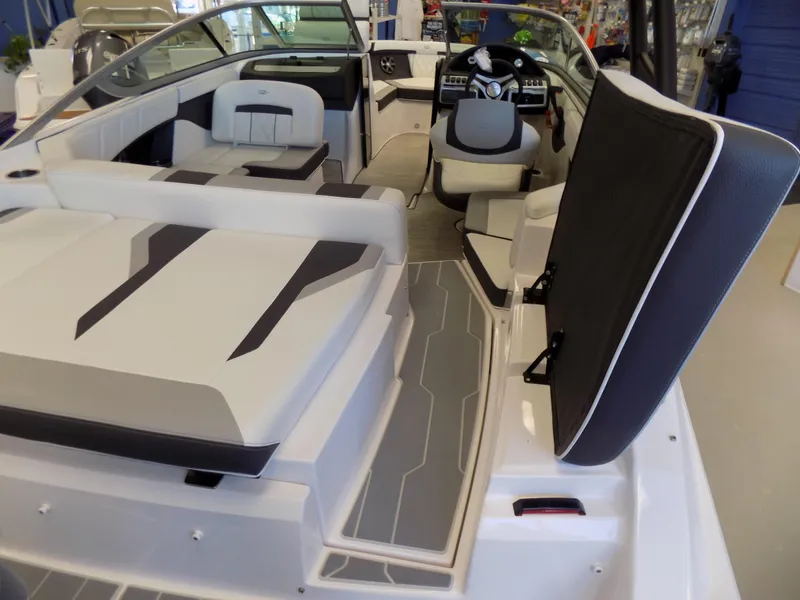 Slide: The Image of 2023 Regal 21 OBX boat interior with modern seating and steering console. - 5