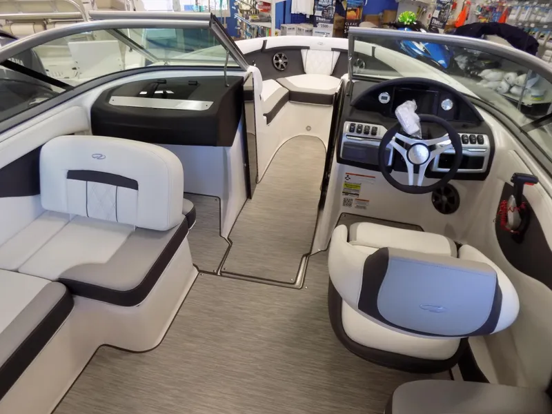 Slide: The Image of 2023 Regal 21 OBX boat interior with modern seating and steering console. - 6