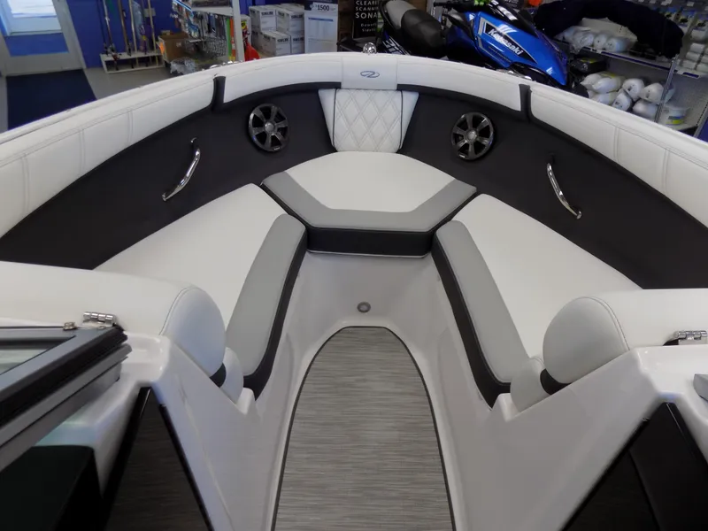 Slide: The Image of 2023 Regal 21 OBX boat interior with white and gray seating, modern design. - 7