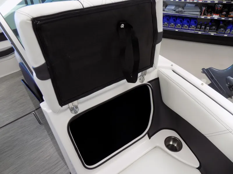 Slide: The Image of 2023 Regal 21 OBX boat interior storage compartment with cup holder. - 9